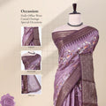 Dola silk saree with floral print and woven border in purple front view on mannequin display.