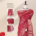 Front view of red Dola saree with floral print woven contrast border and pallu styled on mannequin for display.