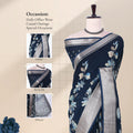 Teal Dola silk saree with floral print and silver woven border front view on mannequin with detailed pallu.