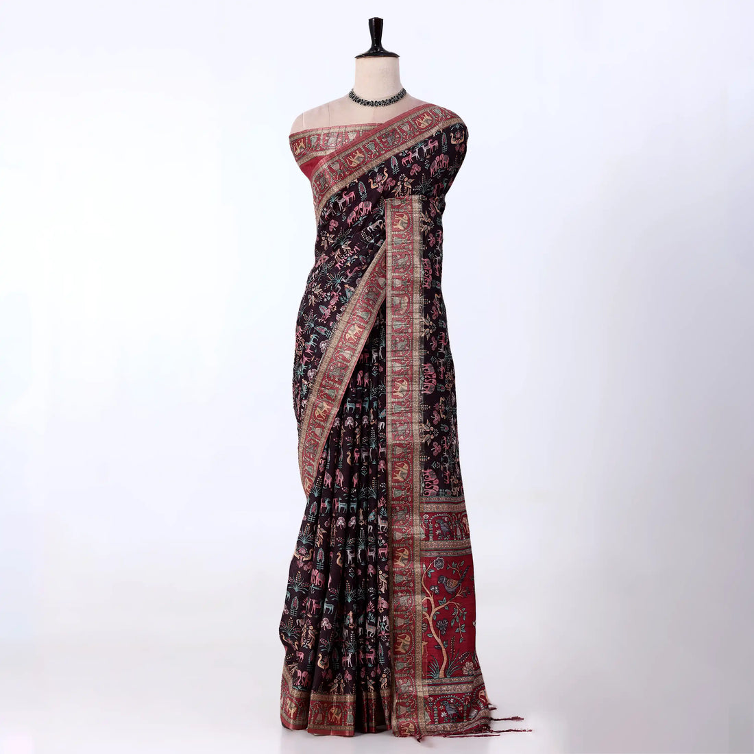 A black and red floral printed saree with intricate gold and red borders