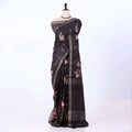 A black and brown plaid saree with pink floral prints