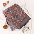 Brown Semi Tussar saree featuring floral print with navy woven border, elegant folded view