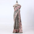 Tusser  saree with muted gray-green base with a pink floral print and a matching border.