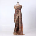 A draped saree with an intricate multicolor floral and geometric pattern