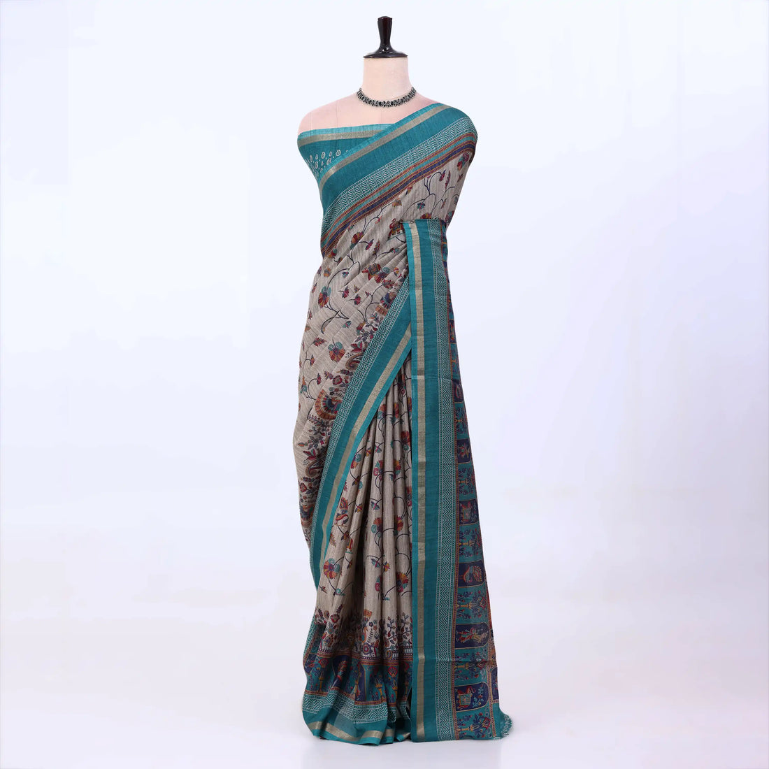 Semi Tussar saree with grey floral printed body and turquoise woven border with decorative pallu.