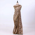 A metallic bronze-brown saree with a floral patterned border