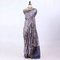 Semi Tussar saree with lavender floral printed body and turquoise woven border with decorative pallu.