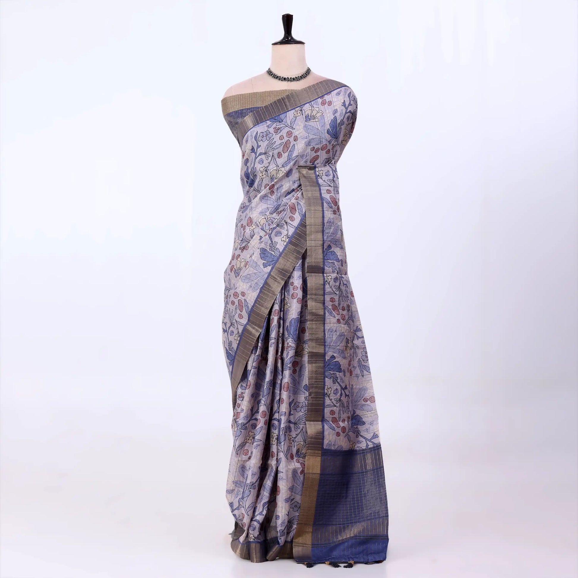 Semi Tussar saree with lavender floral printed body and turquoise woven border with decorative pallu.