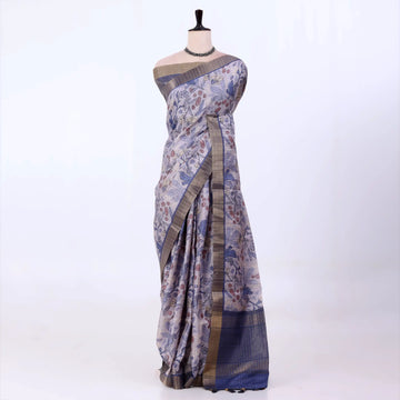 Semi Tussar saree with lavender floral printed body and turquoise woven border with decorative pallu.