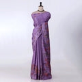 A lavender purple saree with red and orange floral patterns