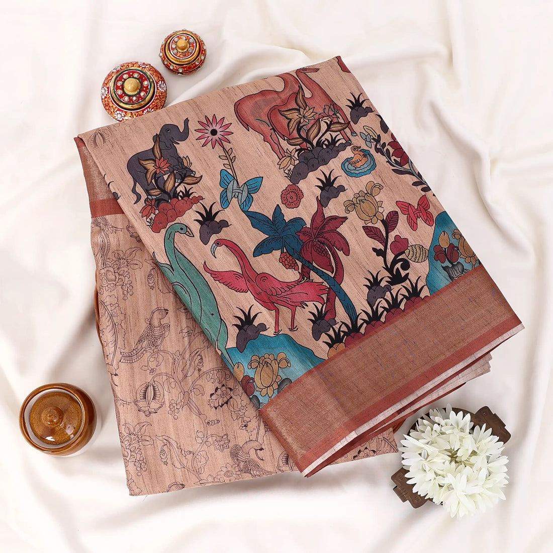 Women's Semi Tussar saree featuring floral print, brown woven border and teal pallu, front display.