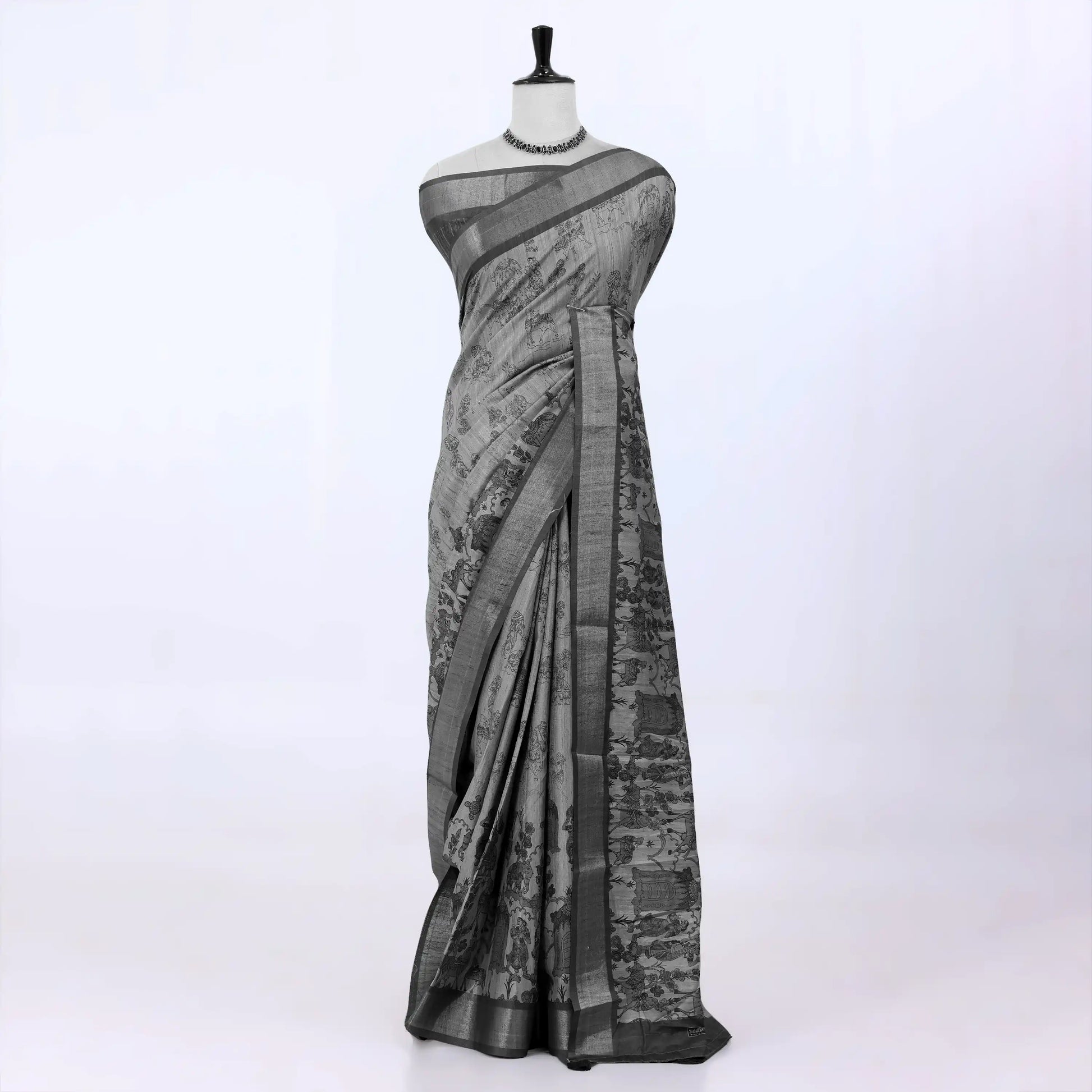 Light green Semi Tussar saree featuring scenic print with dark green woven border, front drape view