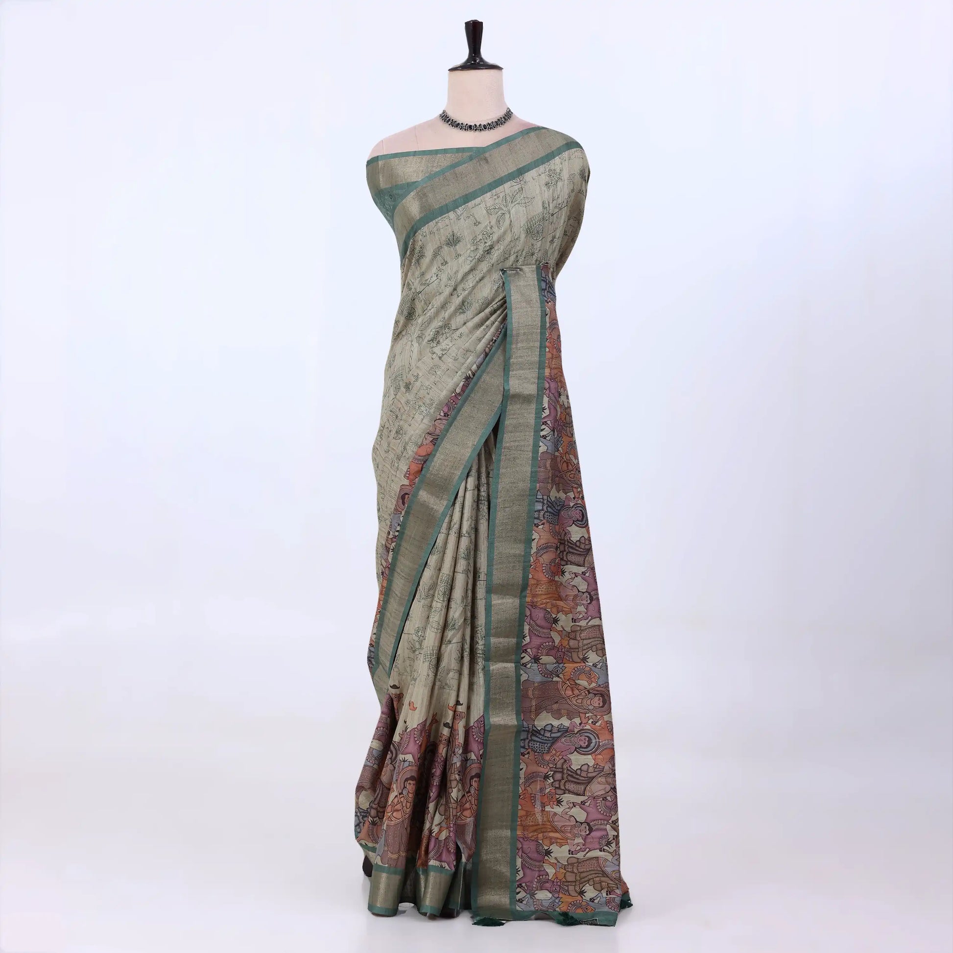Sage green Semi Tussar saree featuring heritage print with teal woven border, elegant front drape view.