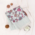 A Foled  sage green striped tusser saree with pink and purple floral prints