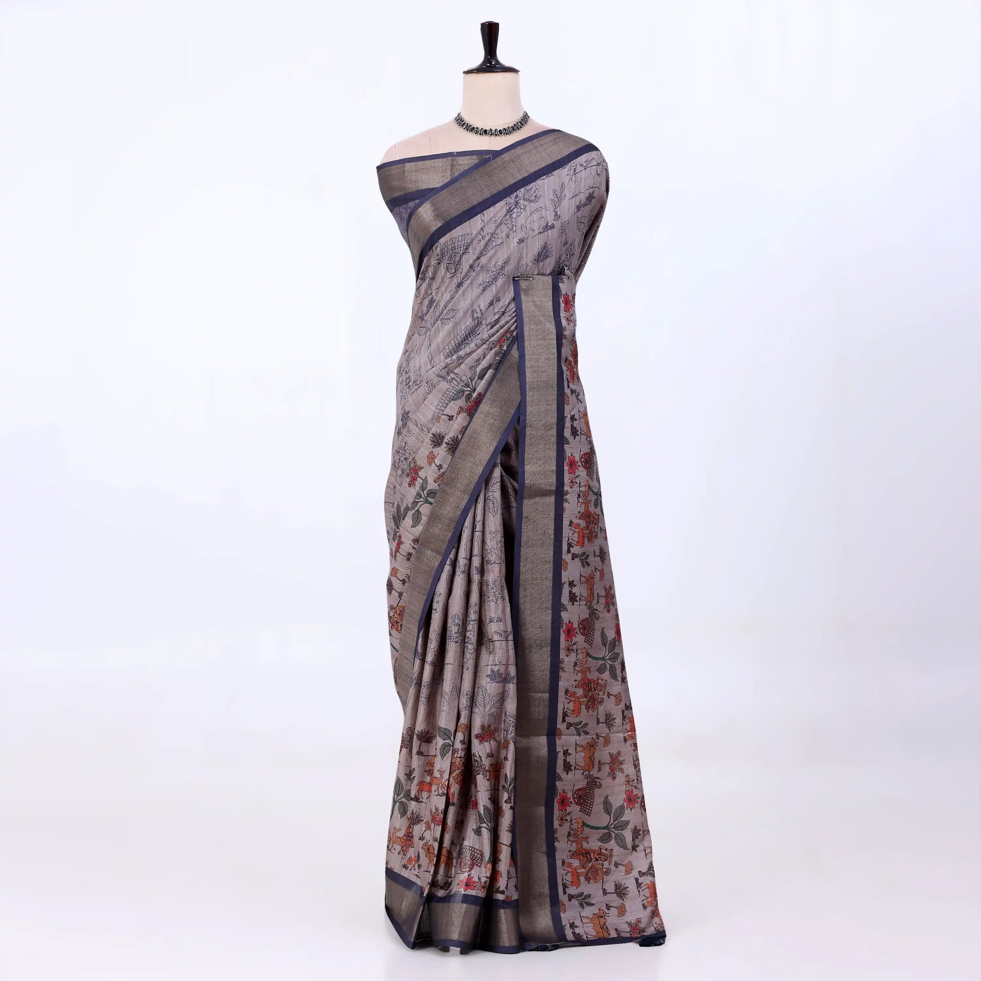 light grey Semi Tussar saree featuring floral print and navy woven border, front drape display.