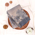 Semi Tussar saree with multi floral printed body and turquoise woven border with decorative pallu.