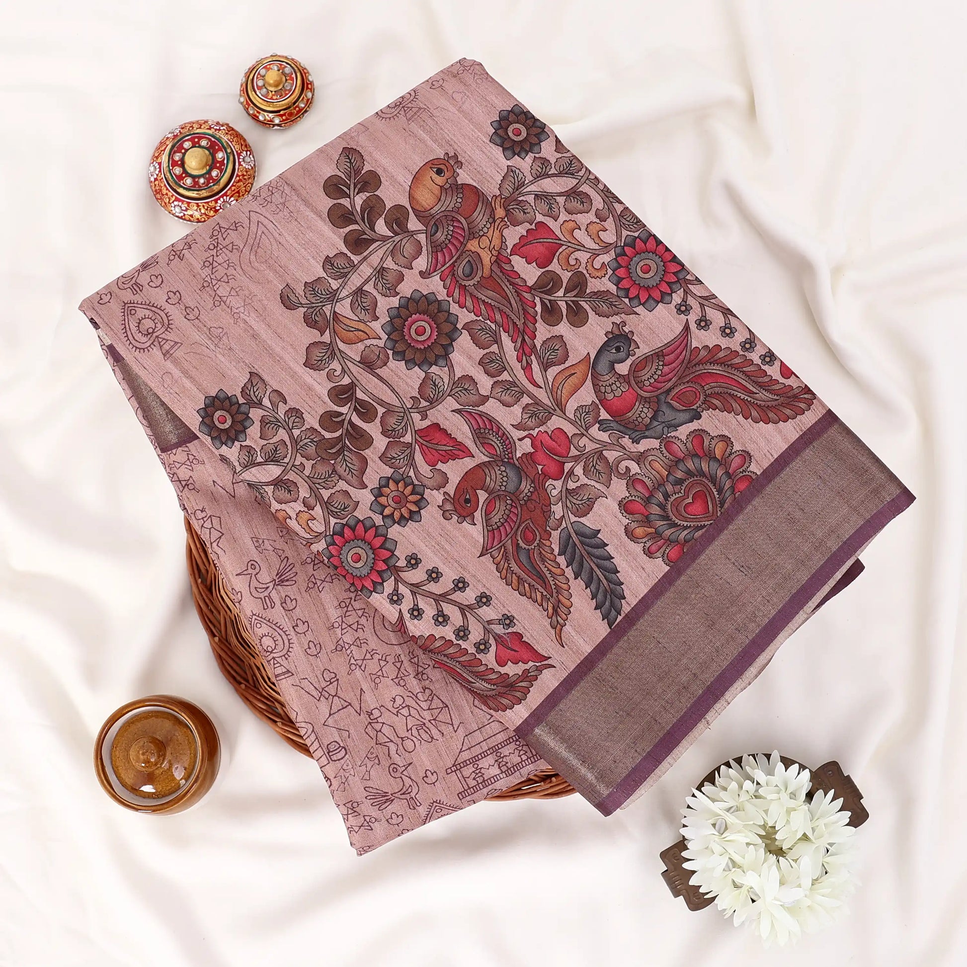 Peach Semi Tussar saree featuring floral print with maroon woven border, elegant folded view