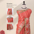 A coral pink and gold printed saree with detail of  head, blouse, and pallu 