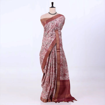 Semi Tussar saree with pink floral printed body and turquoise woven border with decorative pallu.