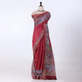 A red and grey printed saree features a sage red body with brown borders