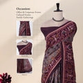 A dark purple saree with a highly detailed multicolor floral and geometric patterned with detail of  head, blouse, and pallu.