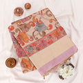 A folded beige fabric piece with a wide multicolor floral and scroll border