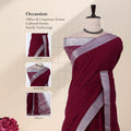 A deep maroon saree with a silver metallic border with detail of  head, blouse, and pallu details.