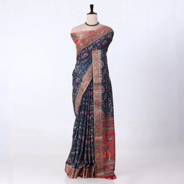 A dark navy blue printed saree with red and beige borders