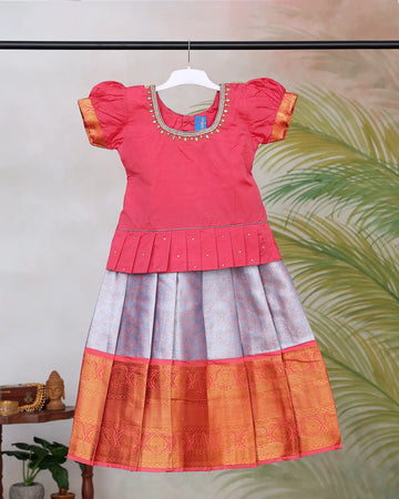Girls Readymade Pattu Pavadai with Embellished Round Neck Blouse Puff Sleeves Decorative Waist Pleats and Traditional Zari Woven Border Long Skirt - Pink