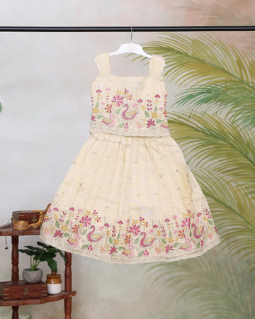 Girls Embroidered Pattu Pavadai Readymade Set with Floral and Peacock Motifs Pleated Skirt and Sleeveless Strap Blouse - Cream
