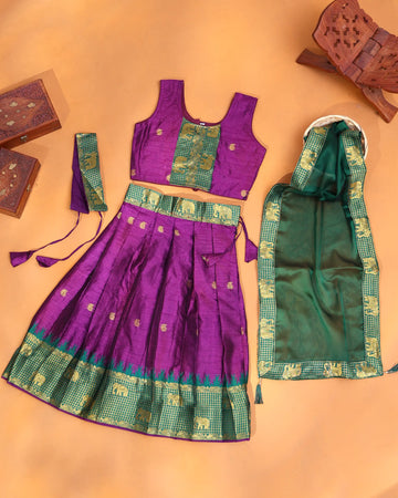 Girls' Vibrant Purple and Emerald Green Art Silk Pavadai Dhavani Set with Traditional Gold Zari Elephant Motif Woven Border