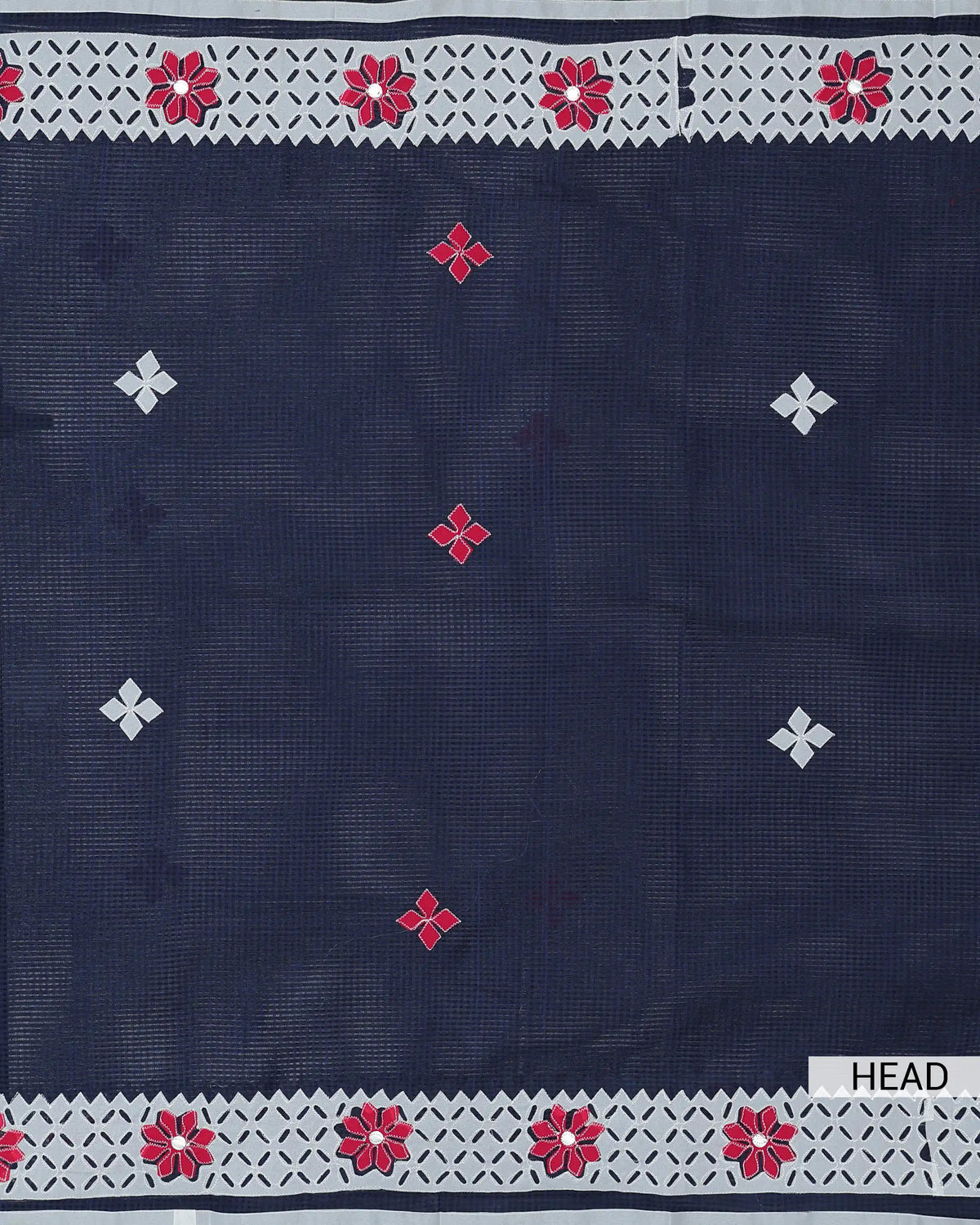 Kota cotton saree delicate floral embroidery scattered four petal motifs and an intricate geometric cutwork border with traditional detailing.