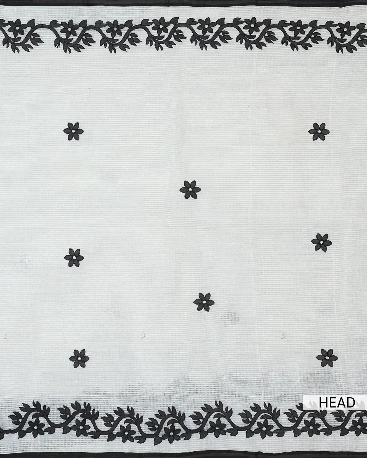 Black floral embroidered cotton saree with sheer white fabric and intricate black vine border front view.
