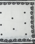 Off white kota cotton saree with intricate floral vine embroidery black scalloped borders and scattered flower motifs pallu view.