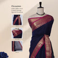 Chettinad cotton saree with traditional zari woven border in royal blue and magenta front draped view on mannequin.