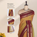 Chettinad cotton saree with yellow checked body maroon zari border and butta motifs front draped view on mannequin.