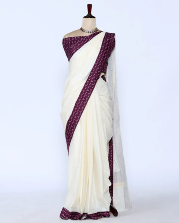 An off-white/cream saree featuring a deep purple border with a white geometric pattern - full view