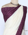 An off-white/cream saree featuring a deep purple border with a white geometric pattern - blouse view