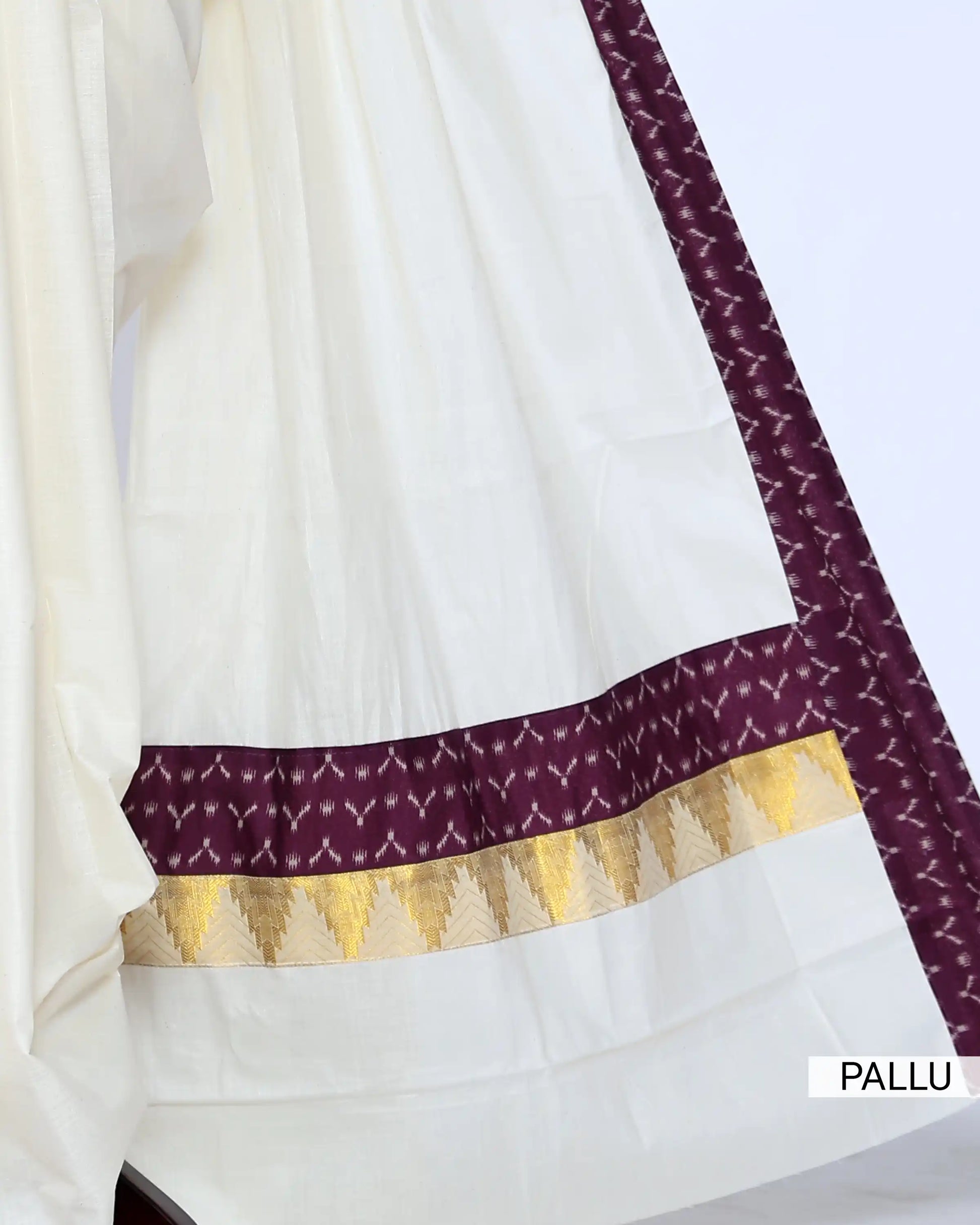 An off-white/cream saree featuring a deep purple border with a white geometric pattern - pallu view