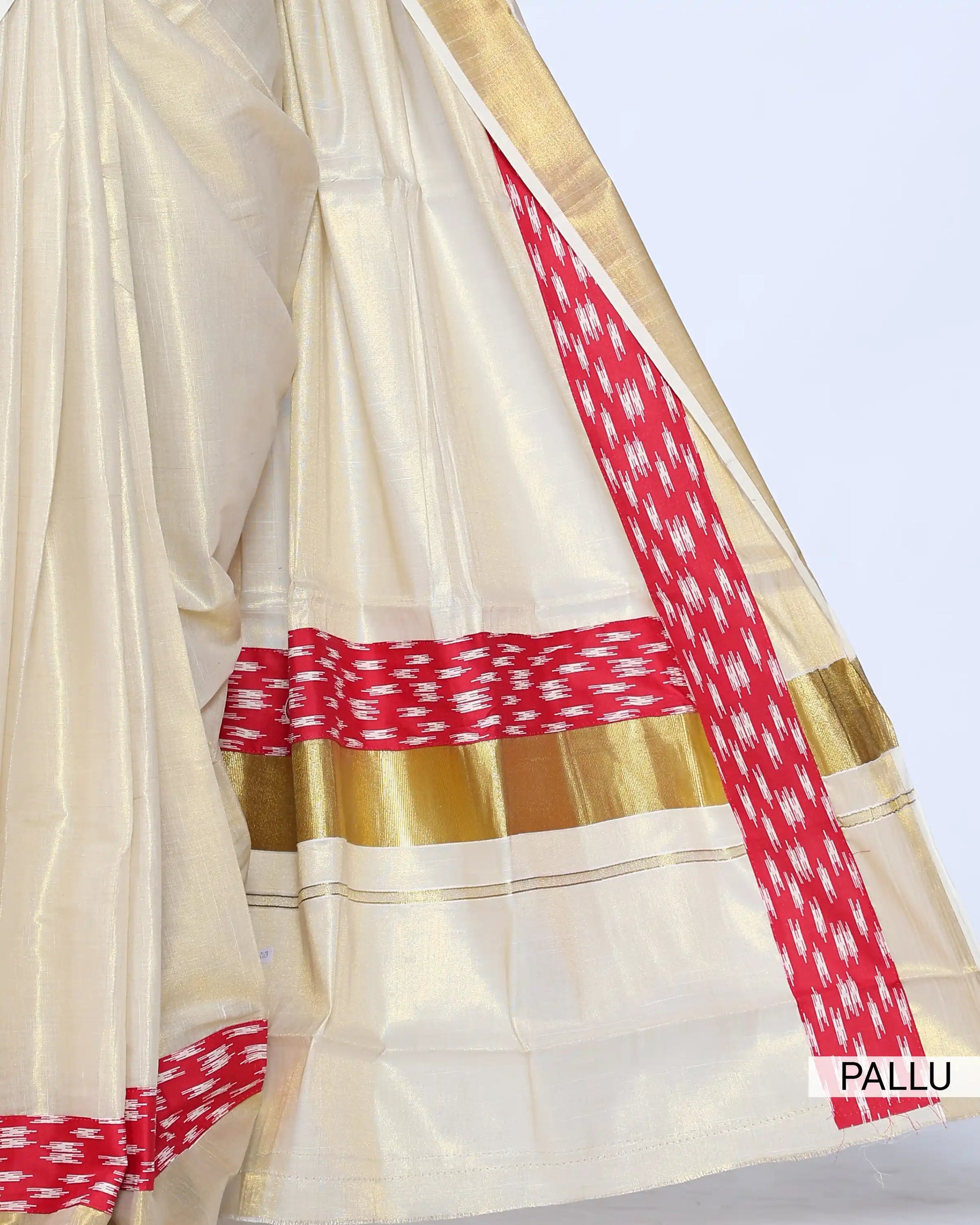 A cream-colored kerala saree with a red and white patterned border and matching blouse - pallu view