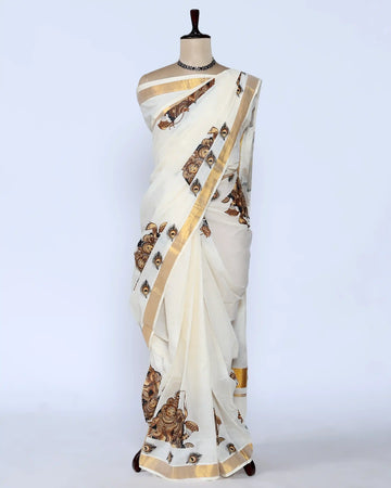 An off-white saree with gold zari borders and brown printed motifs full view