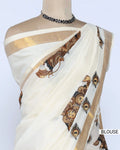 An off-white saree with gold zari borders and brown printed blouse view