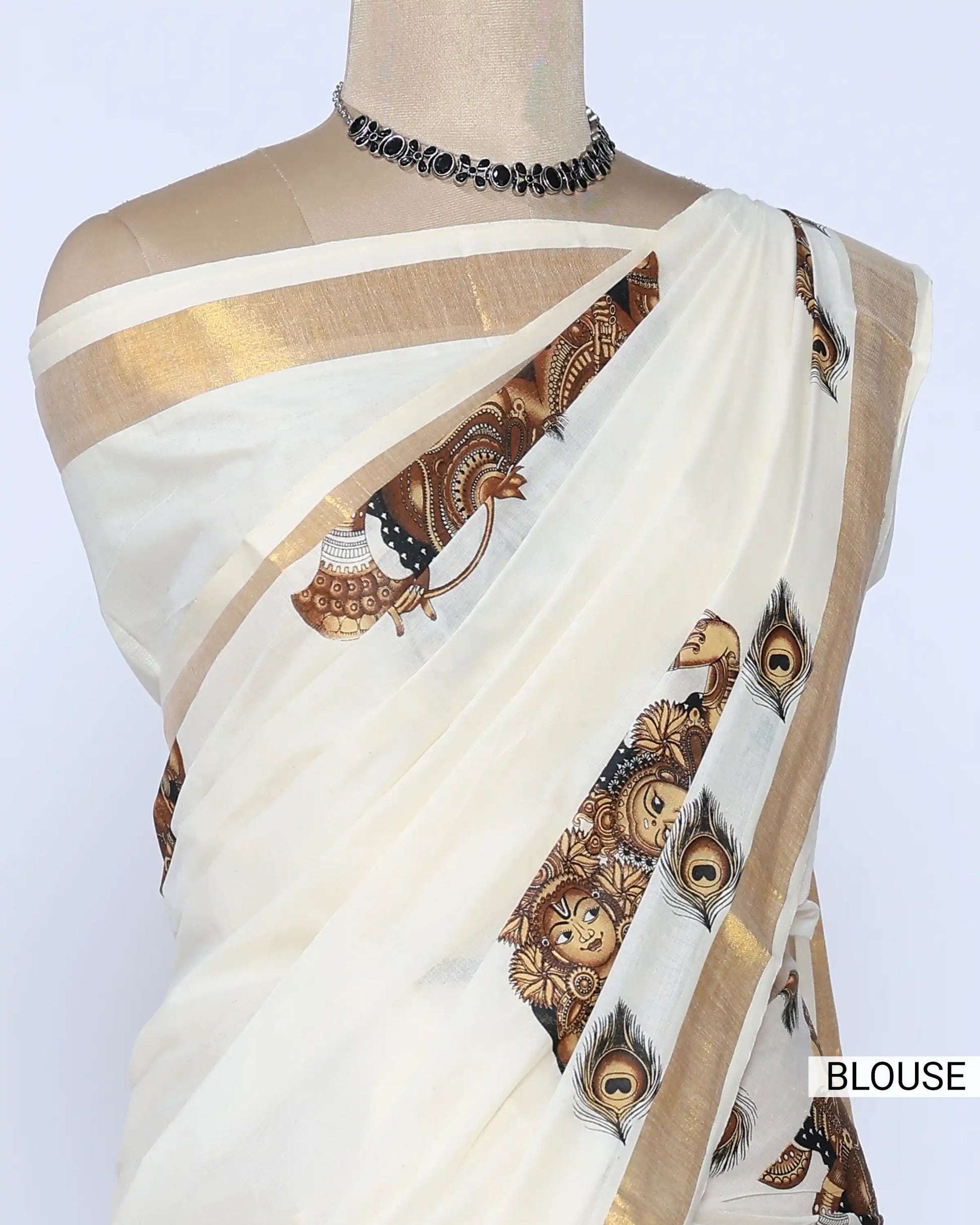 An off-white saree with gold zari borders and brown printed blouse view