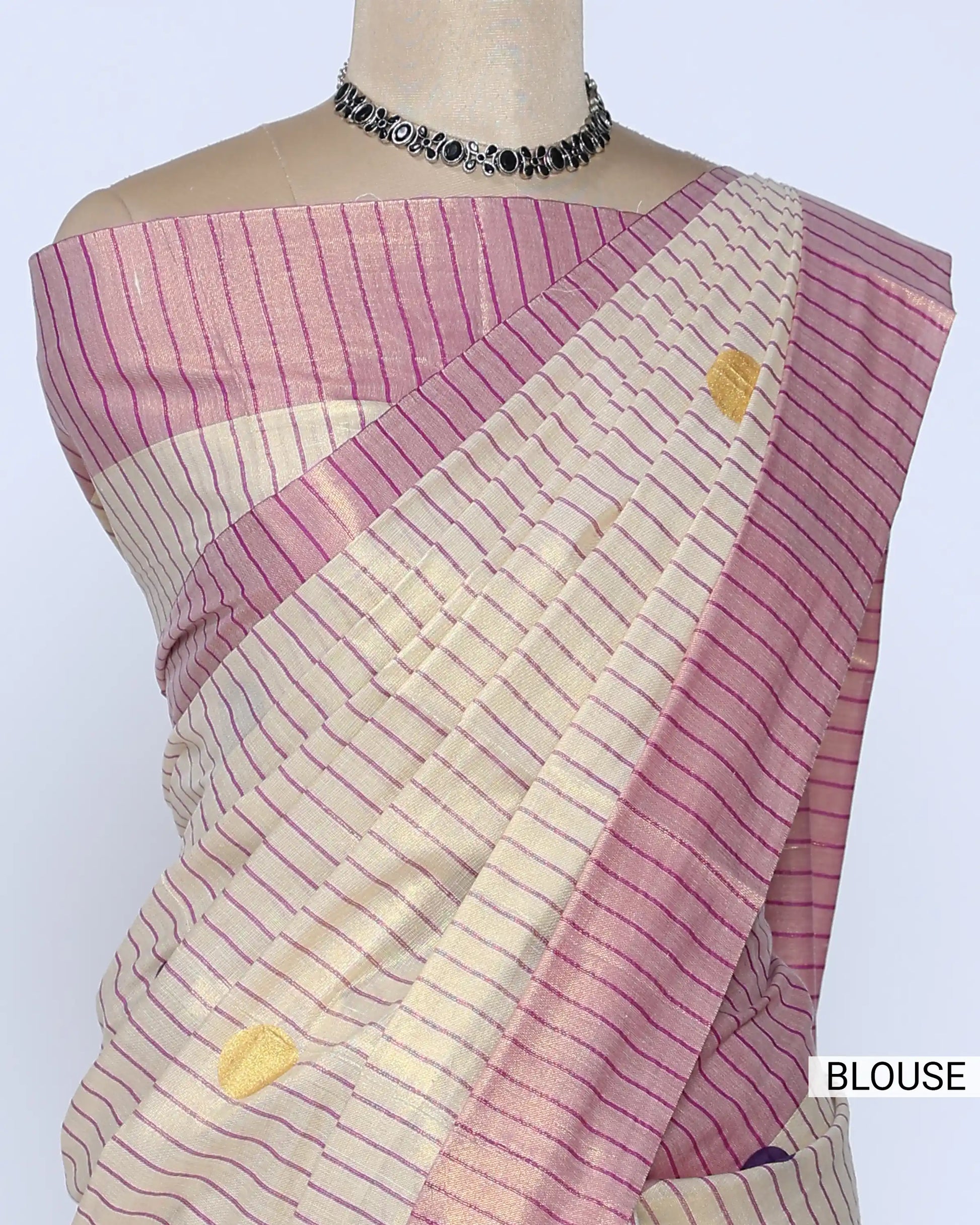 A cream and pink striped kerala saree with a matching pink blouse blouse view