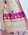 A cream and pink striped kerala saree with a matching pink border  pallu view