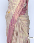 A cream and pink striped kerala saree with a matching pink border  head view