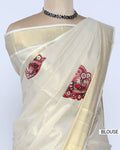 A cream-colored kerala saree with red print blouse view