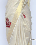 A cream-colored kerala saree with red print head view
