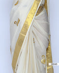 An off-white kerala saree with gold zari embroidery and borders - head view