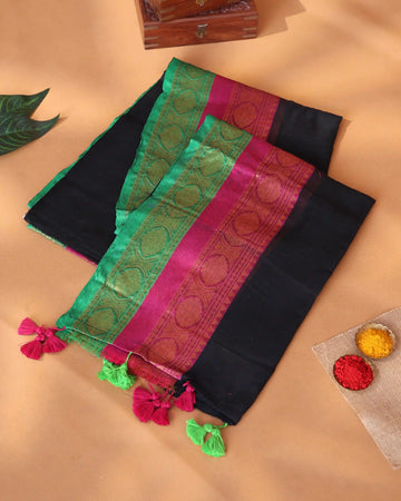 Mul Mul Cotton Saree for Women with Solid Body Floral Woven Border and Decorative Tassel Detailing - Black